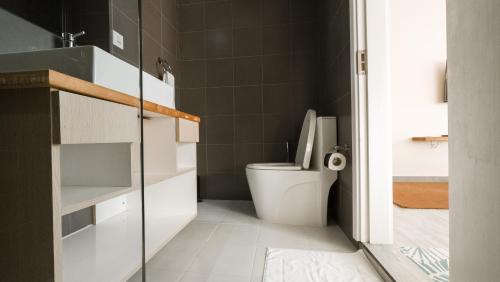 a bathroom with a white toilet in a room at Lea Spa Hotel in Maafushi