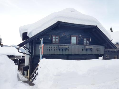 a house with snow on top of it at Wunderprächtiges Berghüttenerlebnis am Nassfeld in Hermagor