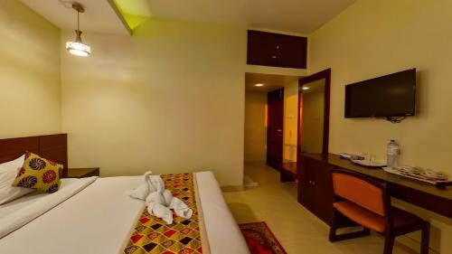Телевизор и/или развлекательный центр в Hotel Sea Cox