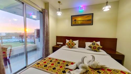 Кровать или кровати в номере Hotel Sea Cox