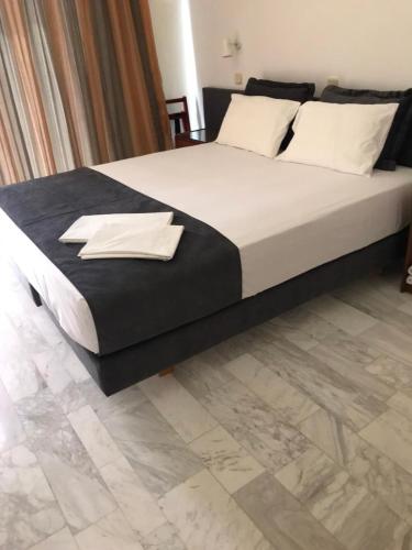 Ένα ή περισσότερα κρεβάτια σε δωμάτιο στο Vlycha Beach Apartments