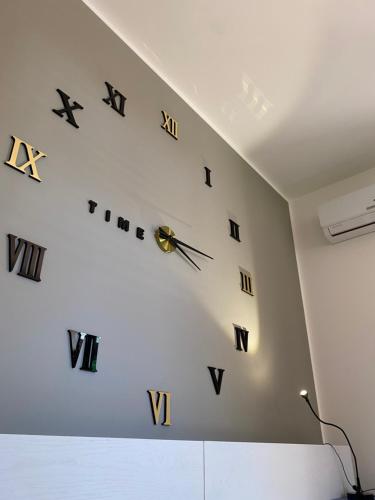 a clock on the wall in a room at ProKite Alby Rondina - RESORT - in Birgi Vecchi