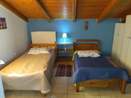 Postel nebo postele na pokoji v ubytování Ρήγας: Όμορφα στο Μεσολόγγι, διαμέρισμα Δ1