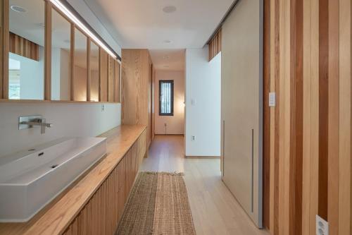 a bathroom with two sinks and a large mirror at Scenery after Rain in Yangyang