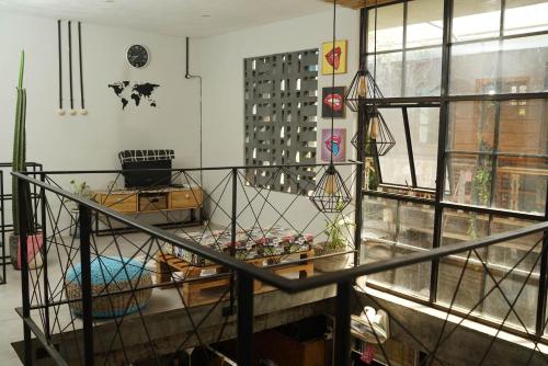 a living room with a table and a window at Happy House BnB Bromo backpacker in Probolinggo