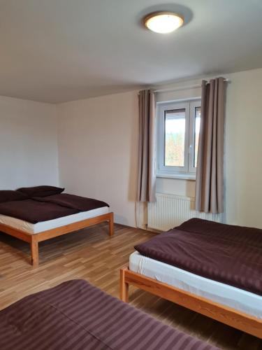 Postel nebo postele na pokoji v ubytování Mega Chalupa MAX