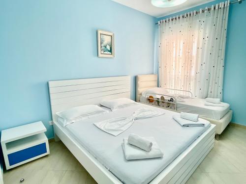 Llit o llits en una habitació de SEA SIDE SUITE