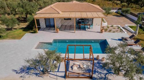 an overhead view of a swimming pool with a house at Tsilivi Pandessia Villa in Tsilivi