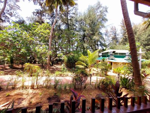 a view of a house from a fence at OmBodhi Retreat in Kumta