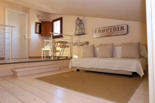 a bedroom with a bed and a sign on the wall at Sweet home tuscany in Bientina