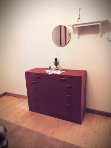 a dresser with a mirror on top of it at Village House Grevena in Grevena