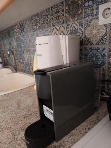 a coffee maker sitting on a counter in a kitchen at Village House Grevena in Grevena