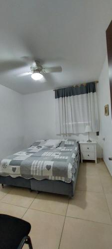 a bedroom with a bed and a ceiling fan at Sitrin apartment Leonardo Hotel Area Ashdod in Ashdod