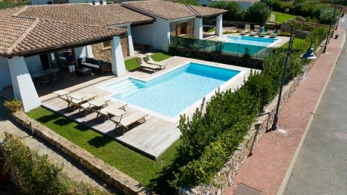 an aerial view of a house with a swimming pool at Capannizza Villas in Budoni