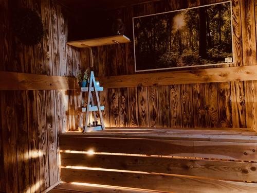 a wooden wall with a ladder in a room at Chalupa Zdíkov na Šumavě in Zdíkov