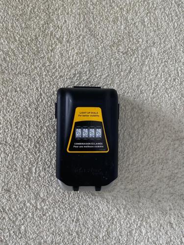 a black electronic device sitting on the floor at Belle Chambre Privée - Salle de bain - Jardin - Wifi - Cuisine partagée - in Wissembourg