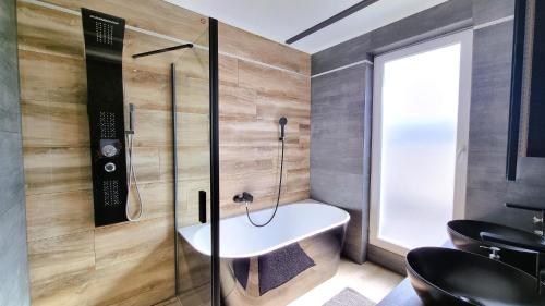 a bathroom with a sink and a shower at Diamond Luxury Apartment in Budapest