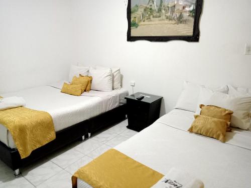 Tempat tidur dalam kamar di Hotel Casa Nini