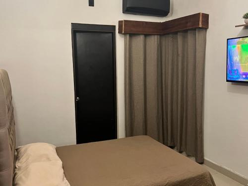 TV a/nebo společenská místnost v ubytování Casa 511 Hotel Boutique