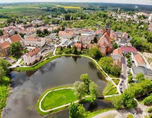 an aerial view of a small town with a river at Apartament Warmińska in Barczewo
