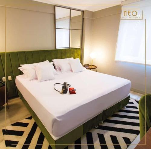 Un ou plusieurs lits dans un hébergement de l'établissement Neo Hotel Boutique