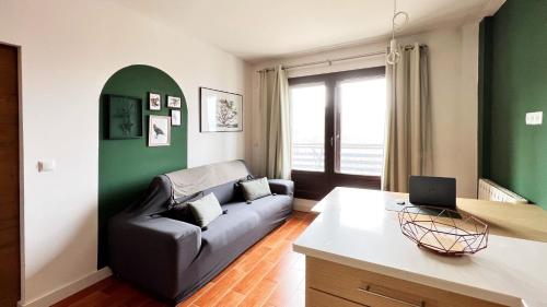 a living room with a couch and a table at Casa Alquife in Sierra Nevada