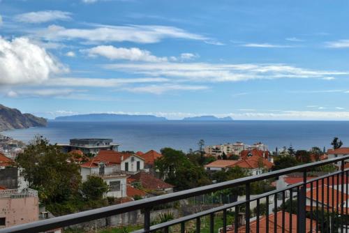 a view of the ocean from a city at Perola, a Home in Madeira in Funchal
