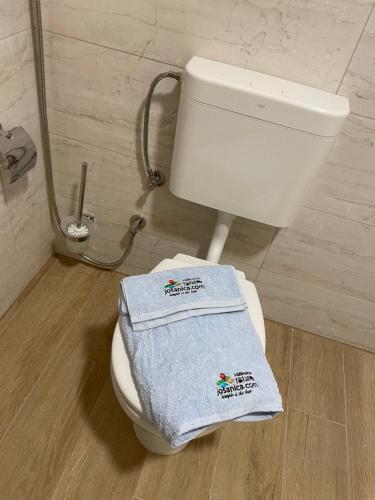 a bathroom with a white toilet with two towels on it at Josanica Bed&Breakfast in Konjic