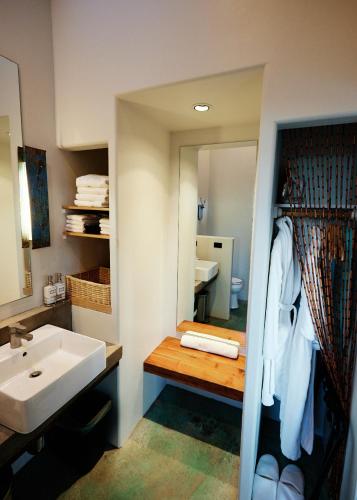 a bathroom with a sink and a mirror at Sacred Sands in Joshua Tree
