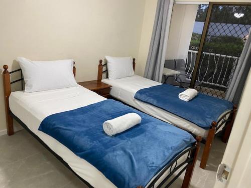 Ένα ή περισσότερα κρεβάτια σε δωμάτιο στο Anchor Down Holiday Apartments