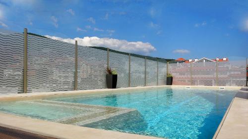 a swimming pool on top of a building at Premium Apartment Villa Aristo in Sveti Vlas