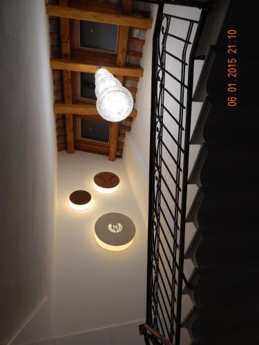 a spiral staircase with a light in a room at Hotel Nazionale in Ferrara