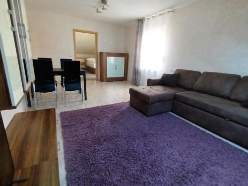 a living room with a couch and a table at 3 Zimmerwohnung optimal für Monteure in Reutlingen