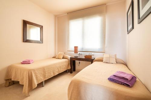 Llit o llits en una habitació de Apartamento de lujo con impresionantes vistas al mar en Torrox Costa