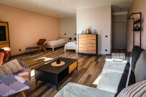 a living room with a couch and a table at Tenis Park Advantage in Bielsko-Biala