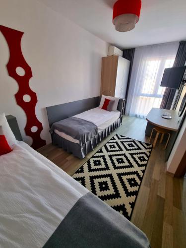 Postel nebo postele na pokoji v ubytování Motel Via Targu Mures