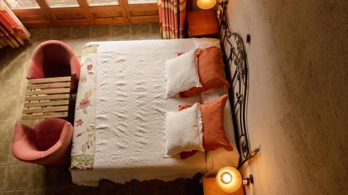 a table with pillows on it in a room at Mas D'en Roqueta in Aravell