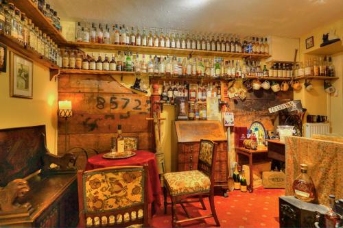 a room with a table and chairs in a store at The Tannochbrae in Dufftown