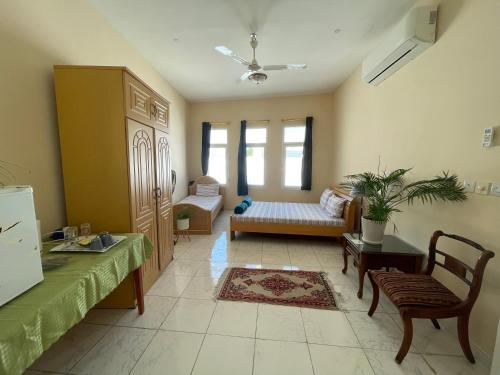 a living room with a couch and a table at old muscat in Muscat