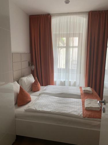 a hotel room with a bed and a window at VIP Apartments in Bratislava