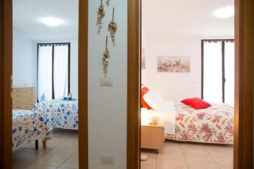 Postel nebo postele na pokoji v ubytování Villa Ludovica, natura, mare e relax a Pescoluse