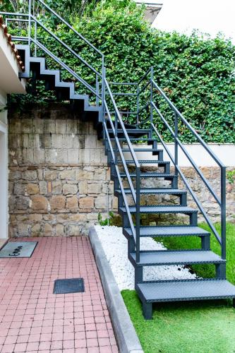 a set of stairs next to a stone wall at Emma 12 in Rome