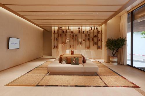 a bedroom with a bed in a room at Centara Korat in Nakhon Ratchasima