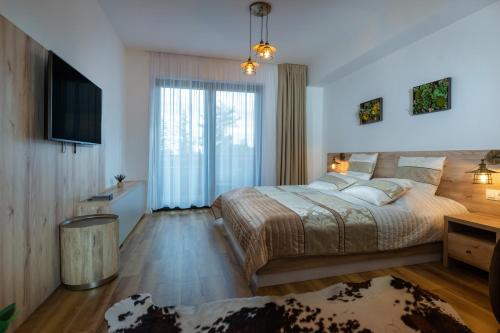 Katil atau katil-katil dalam bilik di TATRYSTAY Armeria Apartments