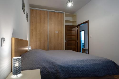 Katil atau katil-katil dalam bilik di TATRYSTAY Armeria Apartments