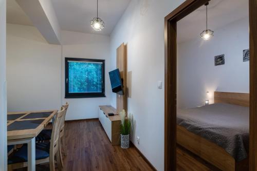 Katil atau katil-katil dalam bilik di TATRYSTAY Armeria Apartments