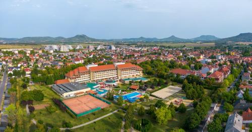 an aerial view of a city with a building at Hunguest Hotel Pelion in Tapolca
