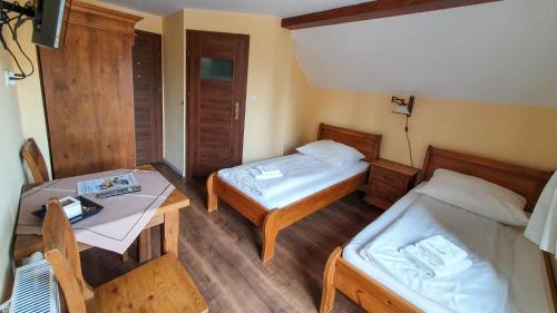 Postel nebo postele na pokoji v ubytování Willa Białka