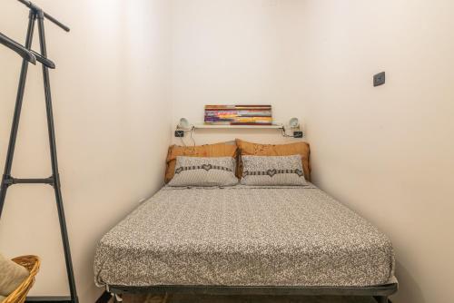 A bed or beds in a room at Casa Pepes centro Ortigia