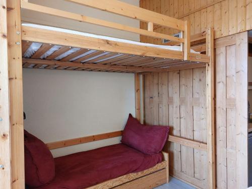 a bunk bed in a wooden cabin with a bunk bed in it at Studio Les Arcs 1800, 1 pièce, 4 personnes - FR-1-411-644 in Arc 1800